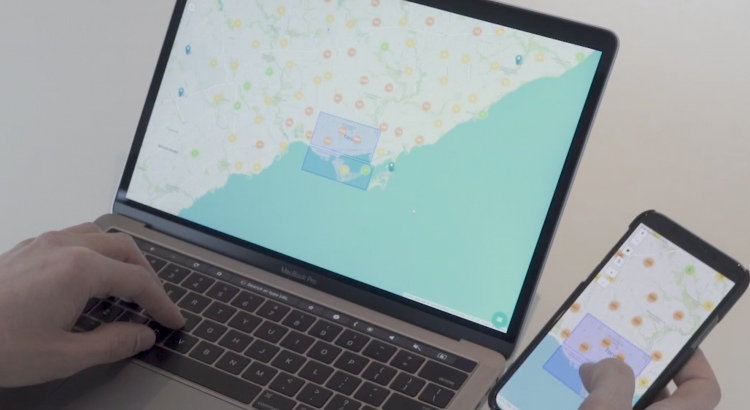 User simultaneously working on the map on a laptop and a smartphone.